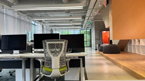 Ergonomic mesh office chair at a height-adjustable desk