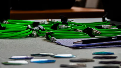 Coiled green cables lying on a table