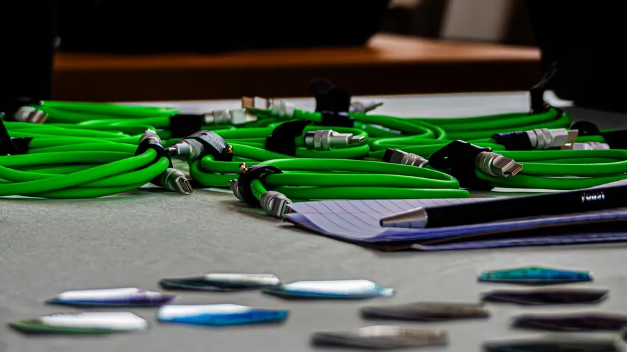 Coiled green cables lying on a table