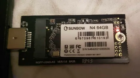 Small M.2 solid-state drive fitted in a USB adapter board
