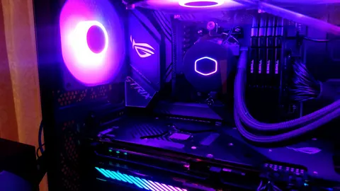 Inside of a gaming PC with an RGB liquid CPU cooler, memory and a graphics card