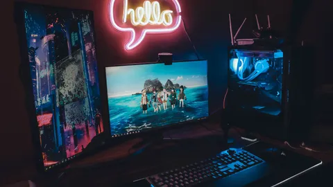 A gaming PC and monitor setup used to check system specifications