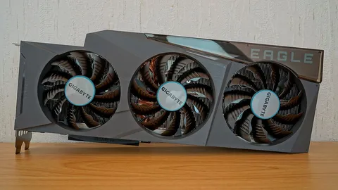 Gigabyte GeForce RTX 3090 Eagle graphics card with three fans, standing on a wooden desk